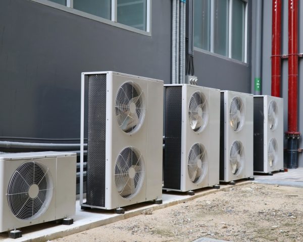31332072_condensing-unit-of-air-conditioning-systems-condensing-unit-installed-in-a-row-outside-the-building.JPG